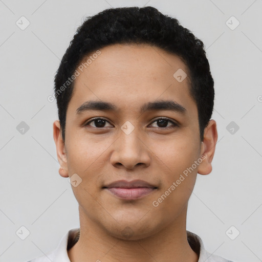 Joyful latino young-adult male with short  black hair and brown eyes