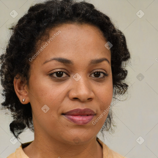 Joyful black adult female with medium  brown hair and brown eyes