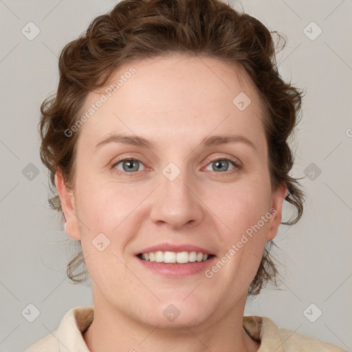 Joyful white young-adult female with medium  brown hair and blue eyes