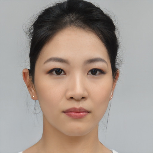 Neutral asian young-adult female with medium  brown hair and brown eyes