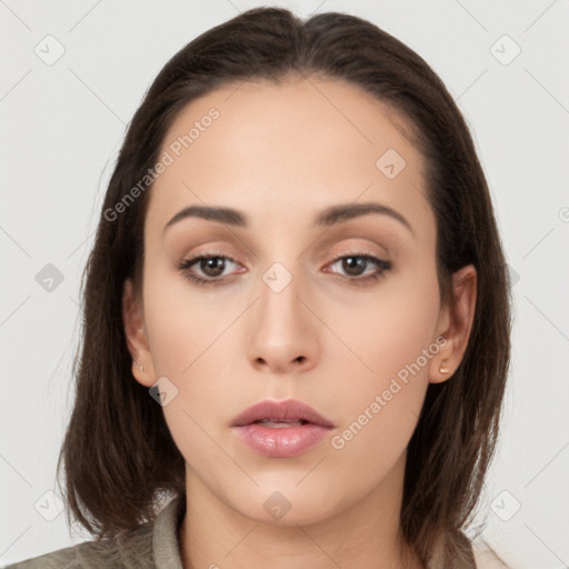 Neutral white young-adult female with long  brown hair and brown eyes