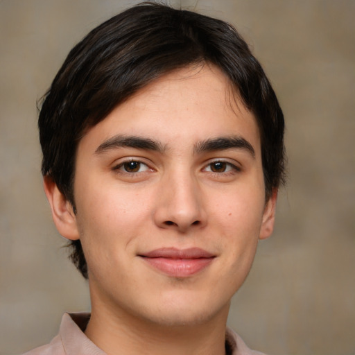 Joyful white young-adult male with medium  brown hair and brown eyes