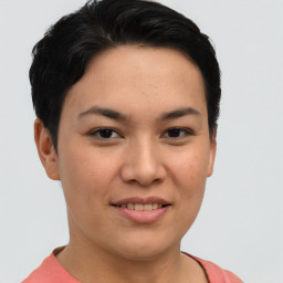 Joyful asian young-adult female with short  brown hair and brown eyes