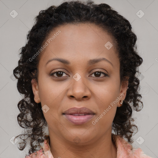 Joyful black young-adult female with medium  brown hair and brown eyes