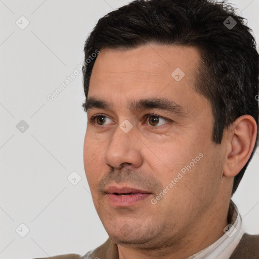 Neutral white adult male with short  black hair and brown eyes