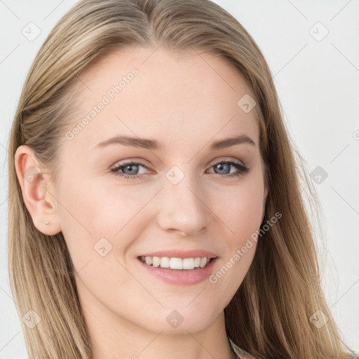 Joyful white young-adult female with long  brown hair and blue eyes