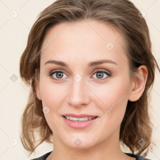 Joyful white young-adult female with medium  brown hair and blue eyes