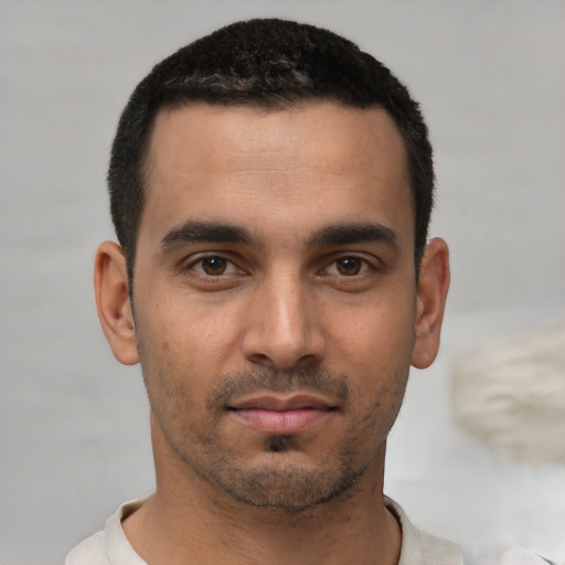 Neutral white young-adult male with short  black hair and brown eyes