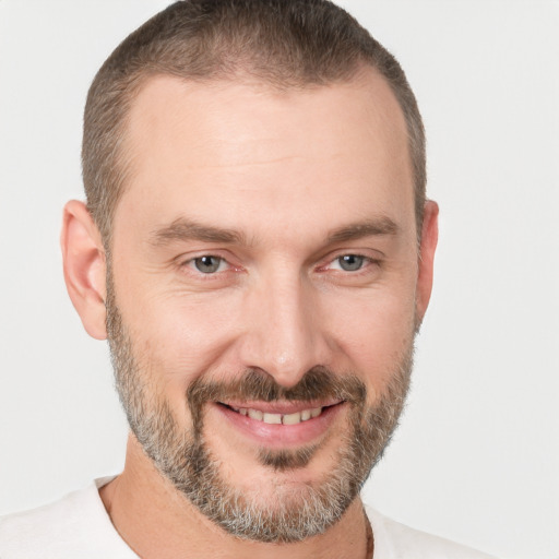 Joyful white adult male with short  brown hair and brown eyes