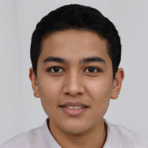 Joyful asian young-adult male with short  black hair and brown eyes