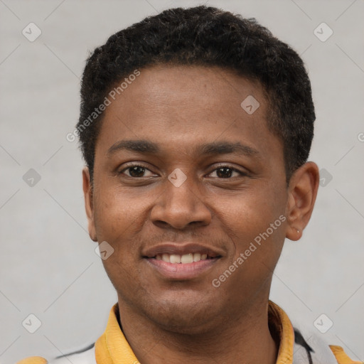 Joyful latino young-adult male with short  brown hair and brown eyes