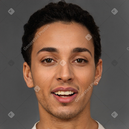 Joyful latino young-adult male with short  brown hair and brown eyes