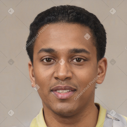 Joyful black young-adult male with short  black hair and brown eyes
