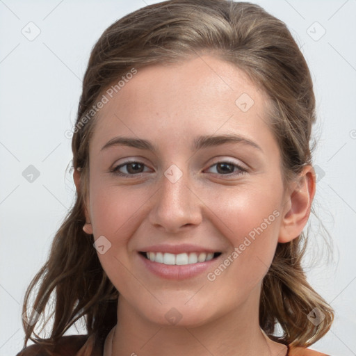 Joyful white young-adult female with long  brown hair and grey eyes