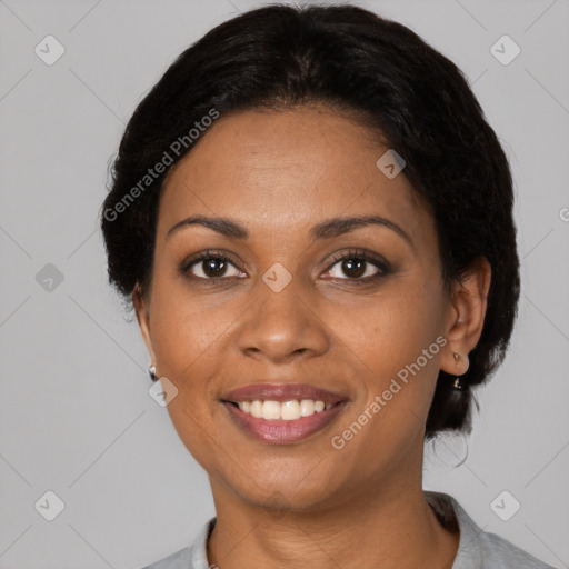 Joyful black young-adult female with short  brown hair and brown eyes