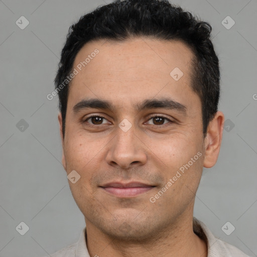 Joyful white young-adult male with short  black hair and brown eyes