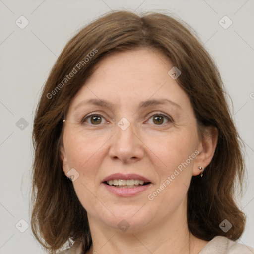 Joyful white adult female with medium  brown hair and grey eyes