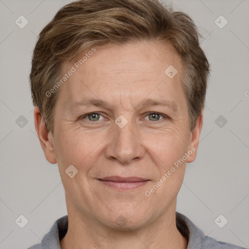 Joyful white adult male with short  brown hair and grey eyes