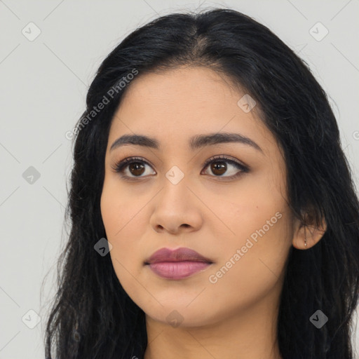 Joyful latino young-adult female with long  black hair and brown eyes