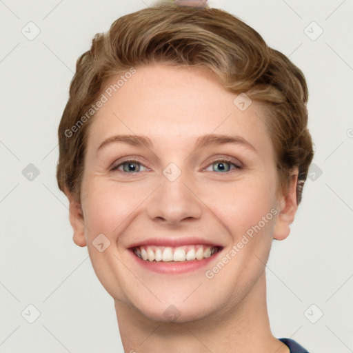 Joyful white young-adult female with short  brown hair and grey eyes