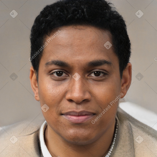 Joyful black young-adult male with short  black hair and brown eyes