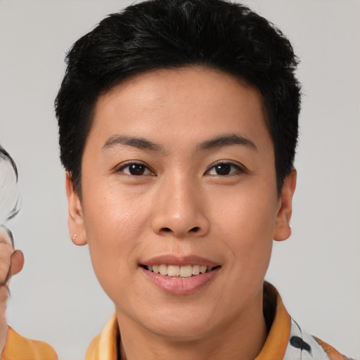 Joyful asian young-adult female with short  brown hair and brown eyes