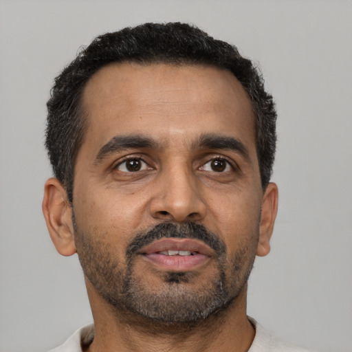 Neutral black adult male with short  black hair and brown eyes