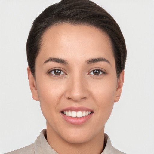 Joyful white young-adult female with short  brown hair and brown eyes