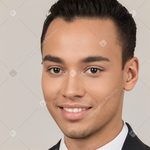 Joyful white young-adult male with short  black hair and brown eyes