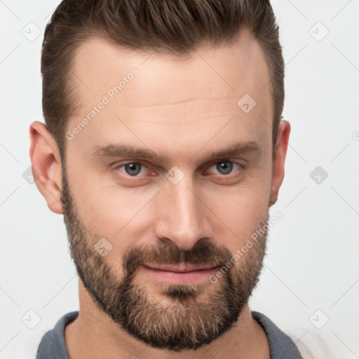 Joyful white adult male with short  brown hair and brown eyes