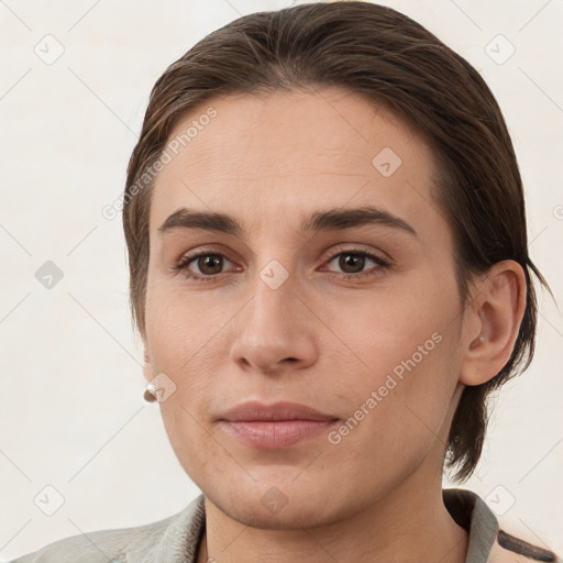 Joyful white young-adult female with medium  brown hair and grey eyes