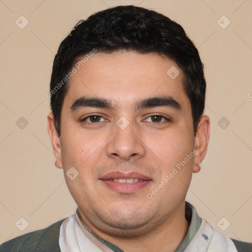 Joyful white young-adult male with short  black hair and brown eyes