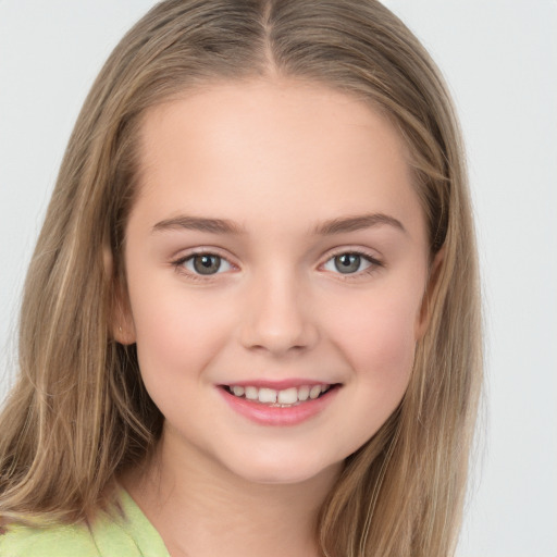 Joyful white child female with long  brown hair and brown eyes