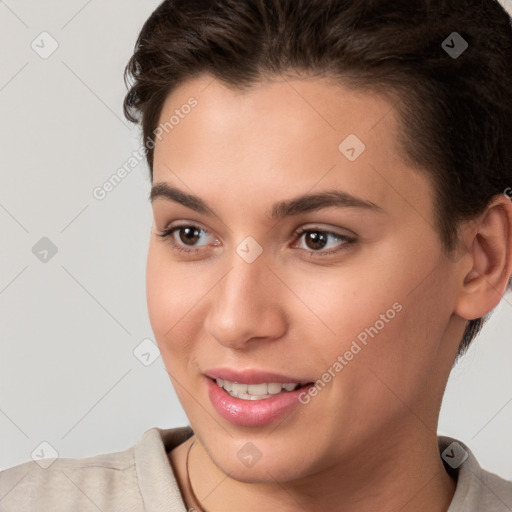 Joyful white young-adult female with short  brown hair and brown eyes