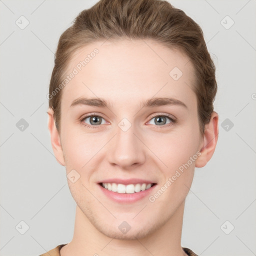 Joyful white young-adult female with short  brown hair and grey eyes