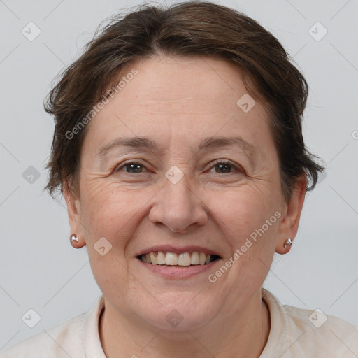 Joyful white adult female with short  brown hair and brown eyes