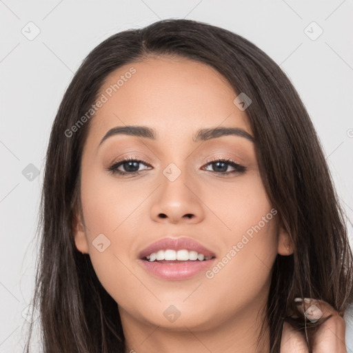 Joyful white young-adult female with long  black hair and brown eyes