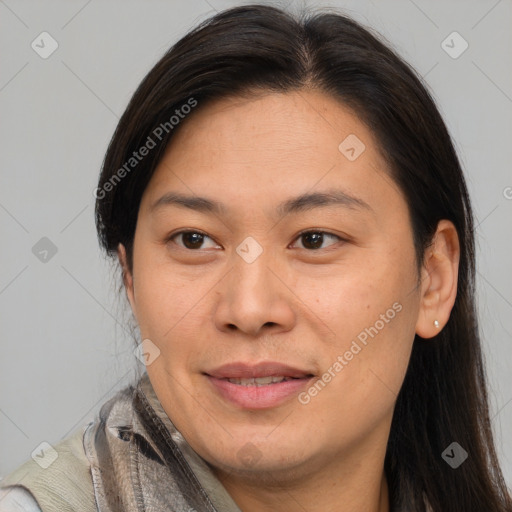 Joyful asian adult female with medium  brown hair and brown eyes