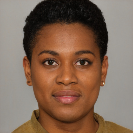 Joyful black young-adult female with short  brown hair and brown eyes