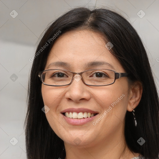 Joyful white adult female with long  brown hair and brown eyes