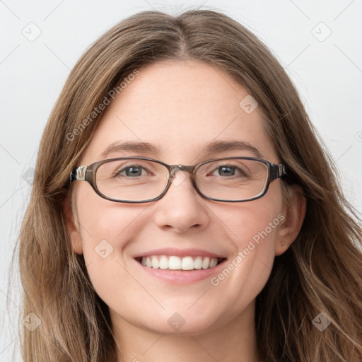 Joyful white young-adult female with long  brown hair and blue eyes