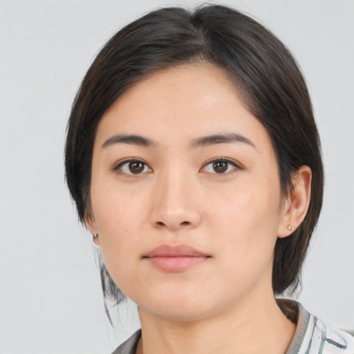 Neutral asian young-adult female with medium  brown hair and brown eyes