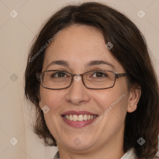 Joyful white adult female with medium  brown hair and brown eyes