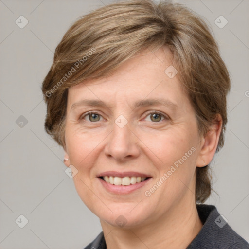 Joyful white adult female with medium  brown hair and grey eyes