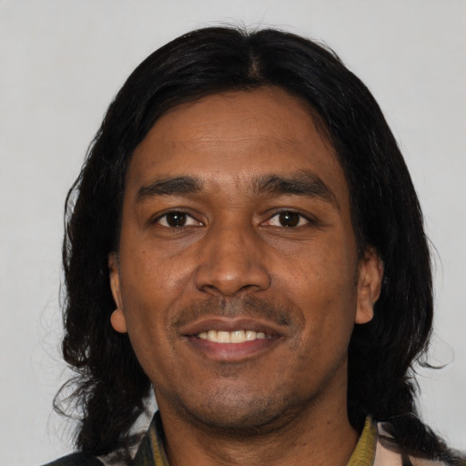 Joyful asian adult male with medium  black hair and brown eyes