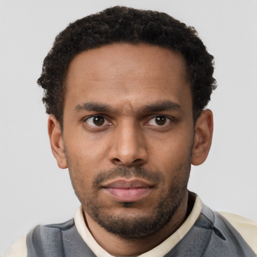 Neutral latino young-adult male with short  brown hair and brown eyes