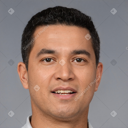 Joyful white young-adult male with short  black hair and brown eyes