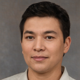 Joyful white young-adult male with short  black hair and brown eyes