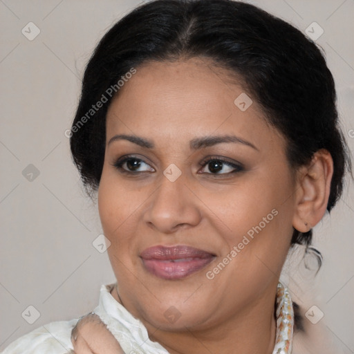 Joyful latino adult female with medium  brown hair and brown eyes