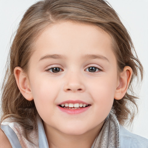 Joyful white child female with medium  brown hair and blue eyes